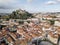 Aerial view of Leiria with red roofs and castle on the hill, Portugal