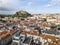 Aerial view of Leiria with red roofs and castle on the hill, Portugal