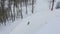 Aerial view lift of skiers and snowboarders on the ski resort