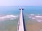 Aerial view of light house pier and blue sea beach