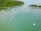 Aerial view of a Lighthouse, boat and yatches docked in marina