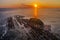 Aerial view of lighthouse covered with rocks at sunrise in Malaysia