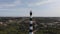 Aerial view of a lighthouse near the sea. Trees and vegetation around it