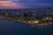 Aerial view of Limassol promenade or embankment with alley and buildings in Cyprus at night. Drone photo of