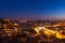 Aerial view of Lisbon rooftop from Senhora do Monte viewpoint (Miradouro) by night in Portugal