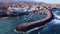 Aerial view of a little fishing town with some colorful boats in Tajao, Tenerife, Canary Islands.