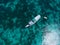 Aerial view of a liveaboard boat in turquoise waters in Pink beach, Komodo, Indonesia