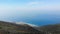 Aerial view from Llogara pass to Albanian Riviera beach, clouds and Ionian Sea coastline