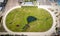 Aerial view of a local horse track with a pond in the infield