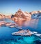 Aerial view at the Lofoten islands, Norway. Mountains and sea during sunset. Natural landscape from air at the drone.