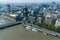 Aerial view of London with Westminster Bridge, Palace of Westminster and Big Ben being renovated in the distance. Black and White