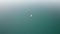 Aerial View Lone Wooden Boat in the Middle of Water Surface of a Mountain Lake