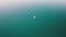 Aerial View Lone Wooden Boat in the Middle of Water Surface of a Mountain Lake