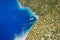 Aerial view of lonely yacht boat in secluded remote beach on the Ionian island of Kefalonia, Greece