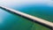 Aerial view of a long highway bridge above a river.