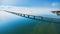 Aerial view of a long highway bridge above a river.