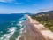 Aerial view at a long sandy beach of Cape Kiwanda natural area.