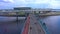 Aerial view of the longest pedestrian bridge in St. Petersburg. People on the bridge.