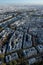 Aerial view looking down at colorful rooftops of Paris.