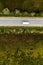 Aerial view of lorry truck on the road through countryside