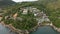 Aerial view of a luxurious beachside hotel near the shore in Phuket Bay, Thailand