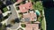 Aerial View of Luxury House With Solar Panel Array on Rooftop by Calabasas Lake