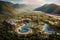 An aerial view of a luxury resort nestled in the mountains with a sparkling pool