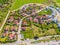 Aerial view of luxury upscale residential neighborhood gated community street real estate with single family homes brick facade