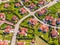 Aerial view of luxury upscale residential neighborhood gated community street real estate with single family homes brick facade