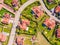 Aerial view of luxury upscale residential neighborhood gated community street real estate with single family homes brick facade