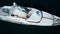 Aerial view of  luxury yacht cruising in deep blue open ocean sea