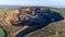 Aerial view of machinery in open gravel pit mining. Processing plant for crushed stone and gravel. Mining equipment