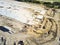 Aerial view machinery working with footing and foundation concrete forming of construction site