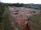 Aerial view made by drone of trucks unloading debris at the Landfill