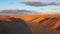 Aerial view of magical Israel desert Negev view. Panoramic landscape of the horizon with shadow terrain curves at