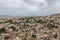 Aerial view at the main Granada cityscape, view from the Alhambra citadel palace lookout, architecture buildings and horizon,