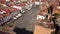 Aerial view of main square in Caceres, Spain in a sunny day with tourists walking. Town hall view.