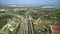 Aerial view of major highway traffic on a sunny day, Autopista del Mediterraneo, Spain