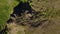 Aerial view of man coming down the mountain. Male hiking down the rocky cliff alone. Climber in the mountains. Guy