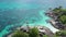 Aerial view of man kayaking in crystal clear sea water near Koh Kra island in Thailand