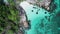 Aerial view of man kayaking in crystal clear sea water near Koh Kra island in Thailand