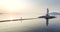 Aerial view of man running fast along the spit at sunrise. Vladivostok, Russia