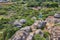 Aerial view of a man standing on top of a rocky plateau in Tobati, Paraguay