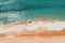 Aerial view of man surfing on the beach. Top view from drone, The man sitting on the beach with Jetski in Perth, Western Australia