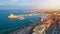 Aerial view of Mandraki port in Rhodes city. Beautiful panorama of the old city of Rhodes island at sunset, Greece.