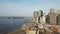 Aerial view of Manhattan in New York, America. Drone flying over the East river, Brooklyn bridge and waving on wind flag