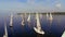 Aerial view of many beautiful sailing yachts in open sea