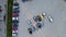 Aerial view of many colorful cars parked on parking lot in evening