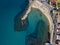 Aerial view of the Marina beach, Pizzo Calabro. The pier and the beach with umbrellas and bathers. Italy