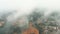 Aerial View Of Marsh, River, Forest Landscape Near Small Town Cityscape Skyline In Misty Autumn Morning. Residential